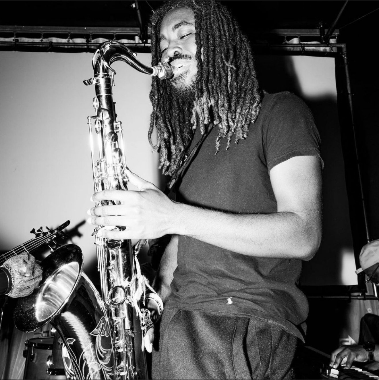 Saxophonist playing during a night set